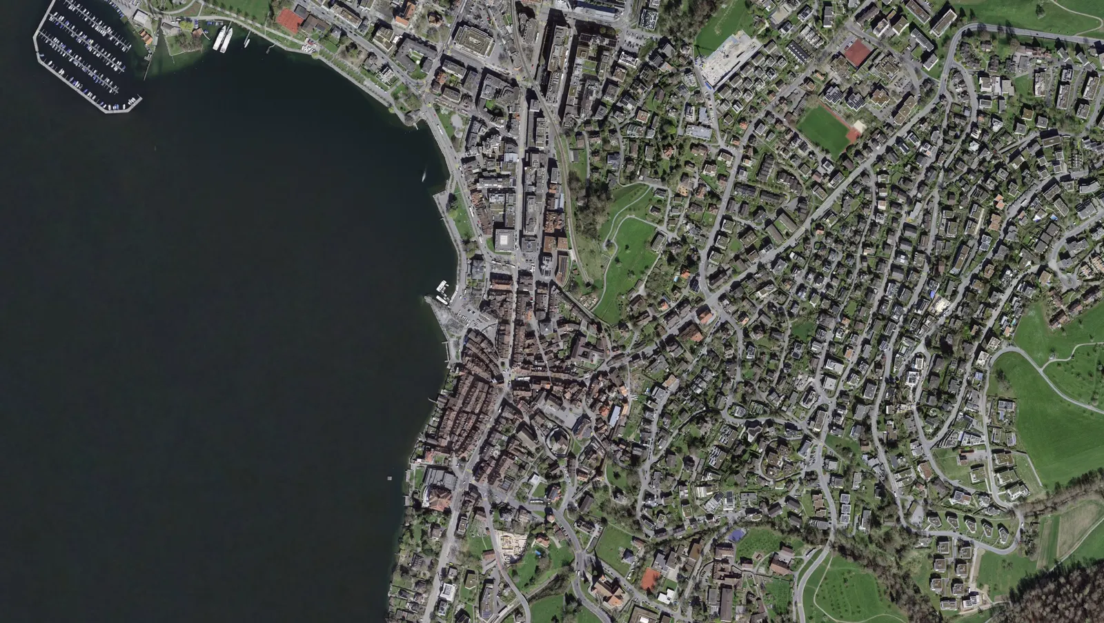 Aerial view of the city of Zug on Lake Zug: the estate agents with an office in the city